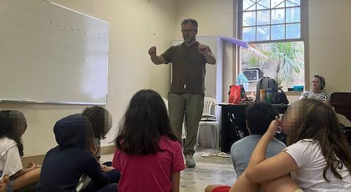 Doug Friesen teaching a group of student